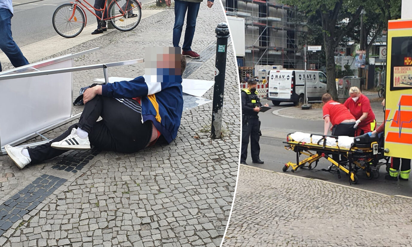 Der Angreifer liegt am Boden, faßt sich ans Knie und wird in einen Krankenwagen gebracht