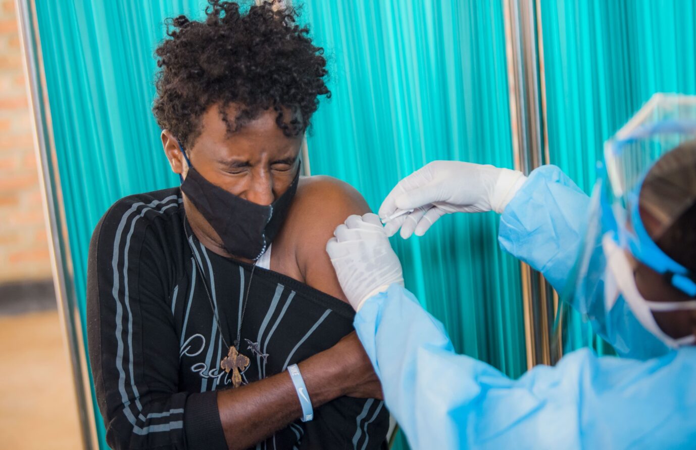 KIGALI, RWANDA - MARCH 10: A male refugee from Libya receives his first dose of coronavirus (COVID-19) vaccine at Gashora Emergency Transit Center in Kigali, Rwanda on March 10, 2021. Habimana Thierry / Anadolu Agency MRNA