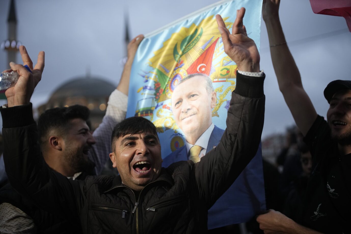 Erdogan's supporters celebrate ahead of his election victory.