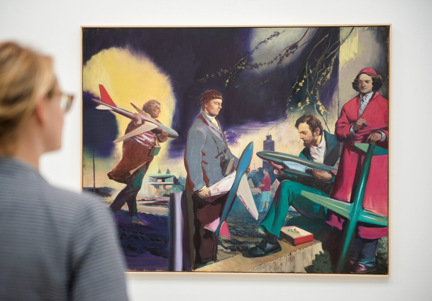 Eine Frau betrachtet das Bild das Werk „Männer mit Flugzeugen“ des Künstlers Neo Rauch. Der Maler ignoriert seit Jahren den „Kampf gegen Rechts“.