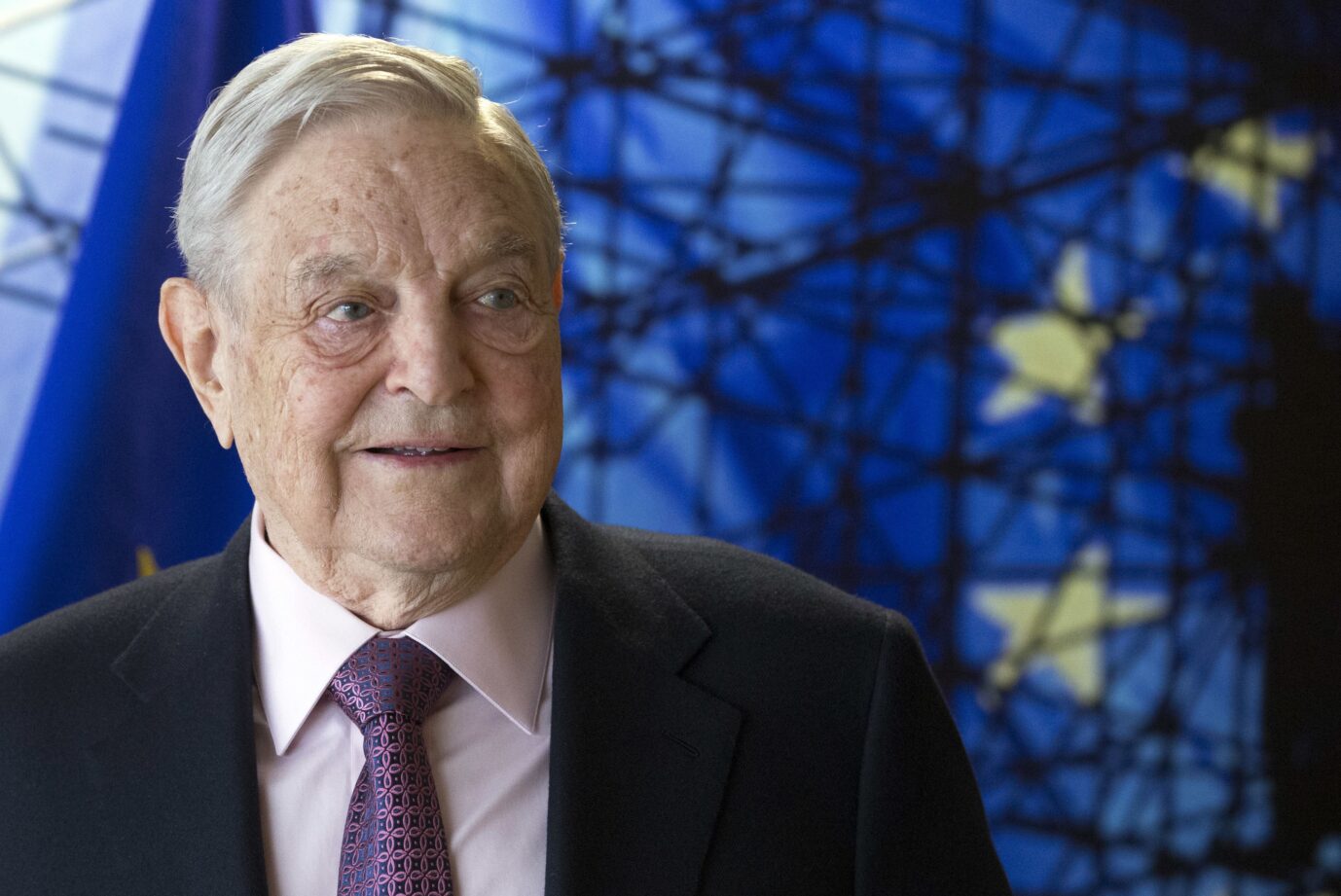FILE - This is a Thursday, April 27, 2017 file photo of George Soros, Founder and Chairman of the Open Society Foundation, as he waits for the start of a meeting at EU headquarters in Brussels . Investor George Soros hit back Thursday June 1, 2017, against Hungarian Prime Minister Viktor Orban over the leader’s attempts to shut down a Budapest university which Soros founded after the fall of communism. (Olivier Hoslet, Pool Photo, File, via AP)