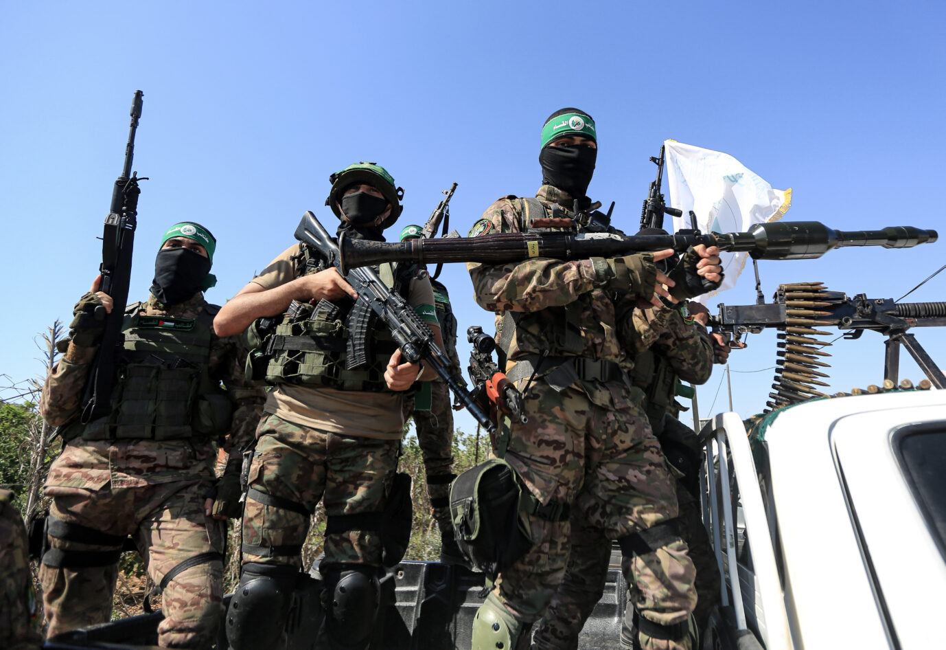 July 19, 2023, Gaza, Palestine: Palestinian fighters from the military wing of the Hamas movement seen on the back of a truck during a military parade near the border with Israel in the central Gaza Strip, during a commemoration of the 2014 war, the 51-day period of the Israeli-Palestinian conflict. (Credit Image: © Yousef Masoud/SOPA Images via ZUMA Press Wire