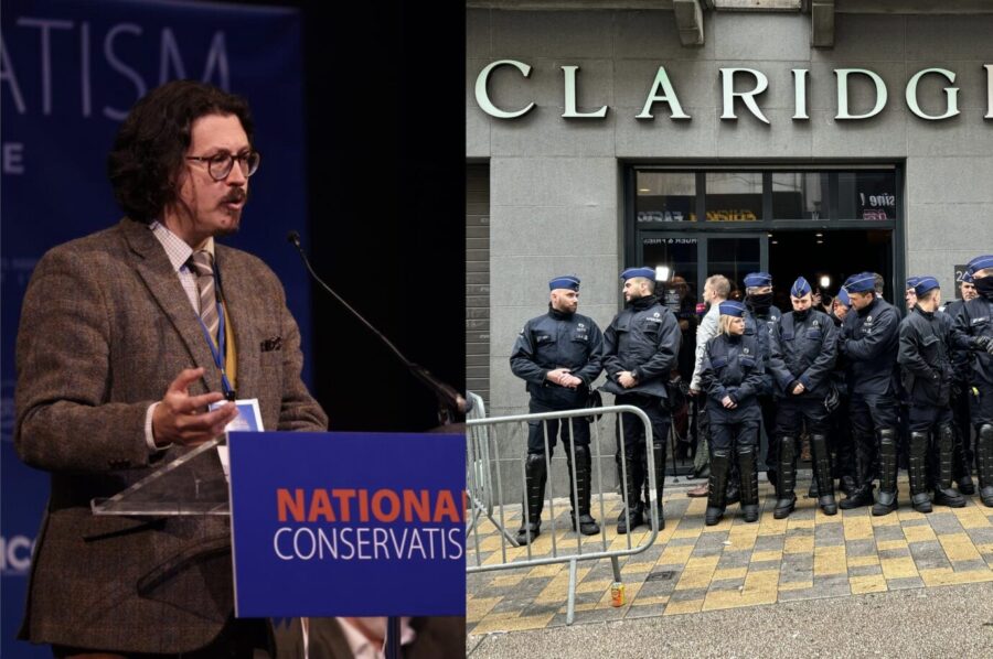 David Engels, in kariertem Jackett, trägt auf der NatCon-Tagung vor. Beamte der belgischen Polizei sperren den Veranstaltungsort in Brüssel ab.