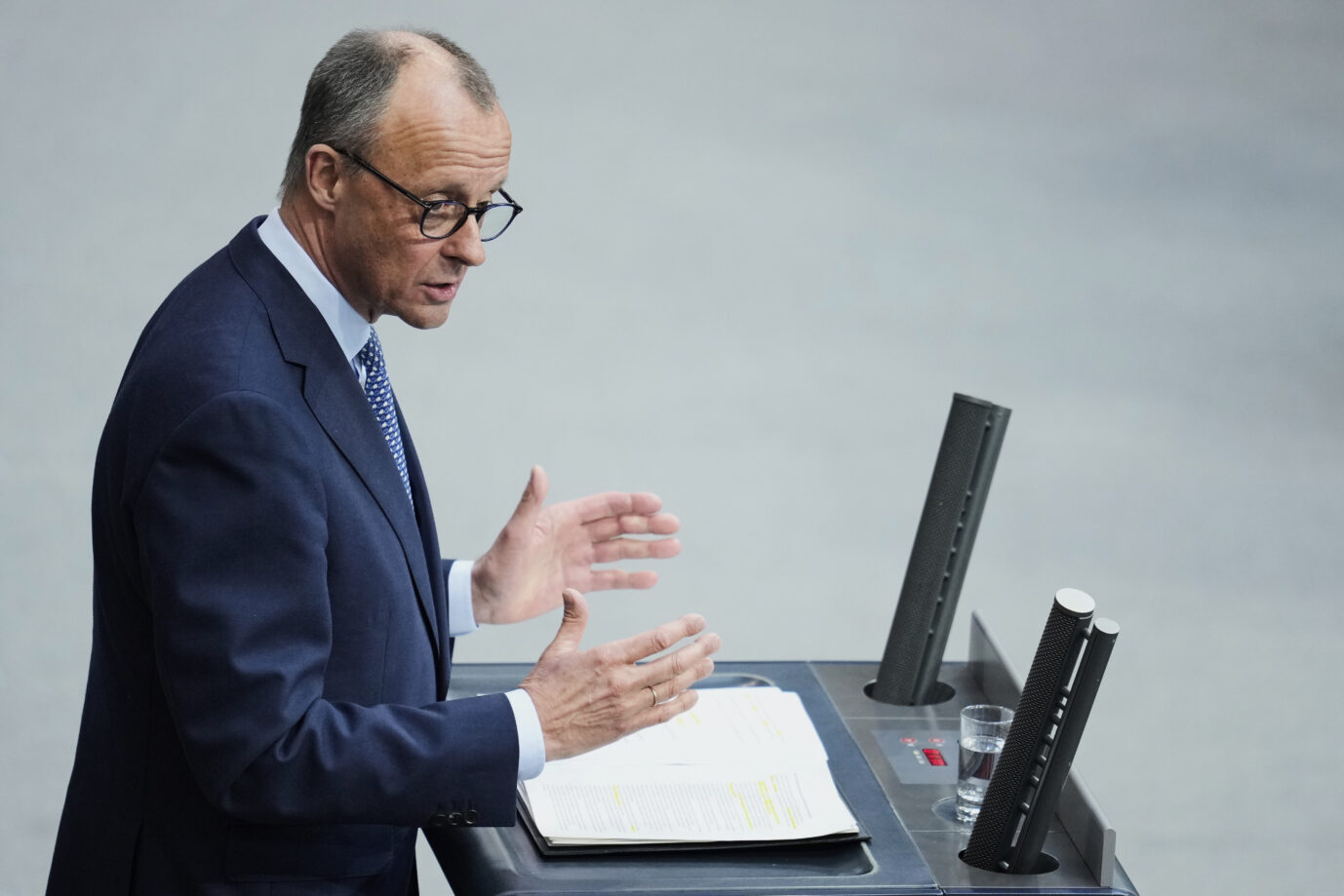 German opposition leader and Christian Democratic Union party chairman Friedrich Merz delivers his speech during a meeting of the German federal parliament, Bundestag, at the Reichstag building in Berlin, Germany, Thursday, March 13, 2025. (AP Photo/Ebrahim Noroozi)