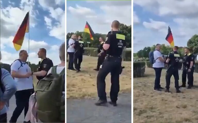 Polizeieinsatz gegen den Mann, der mit einer Deutschlandfahne vor dem Reichstag entlang geht.